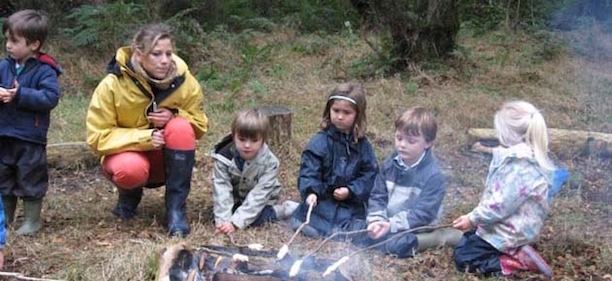children around a campfire